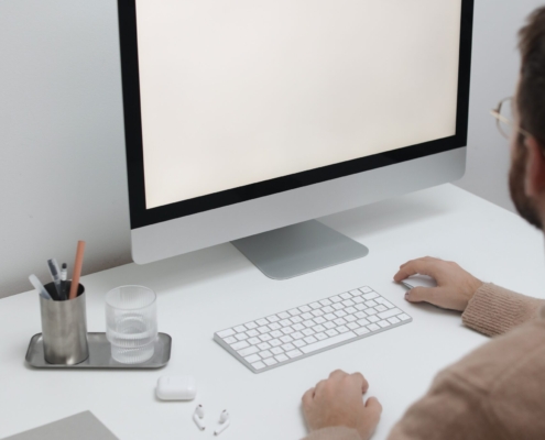 Free Crop man working on computer in workplace Stock Photo