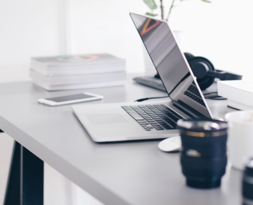 Free Gray Laptop on Table Top Stock Photo